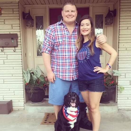 Dr. Dan at home with his wife and dog, Bruce Wayne
